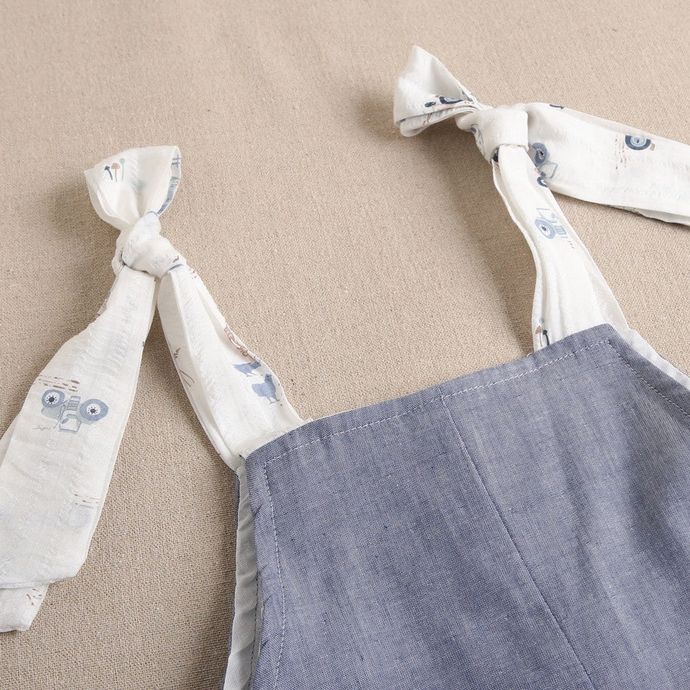 Enterito de niña corto en azul denim combinado con estampado