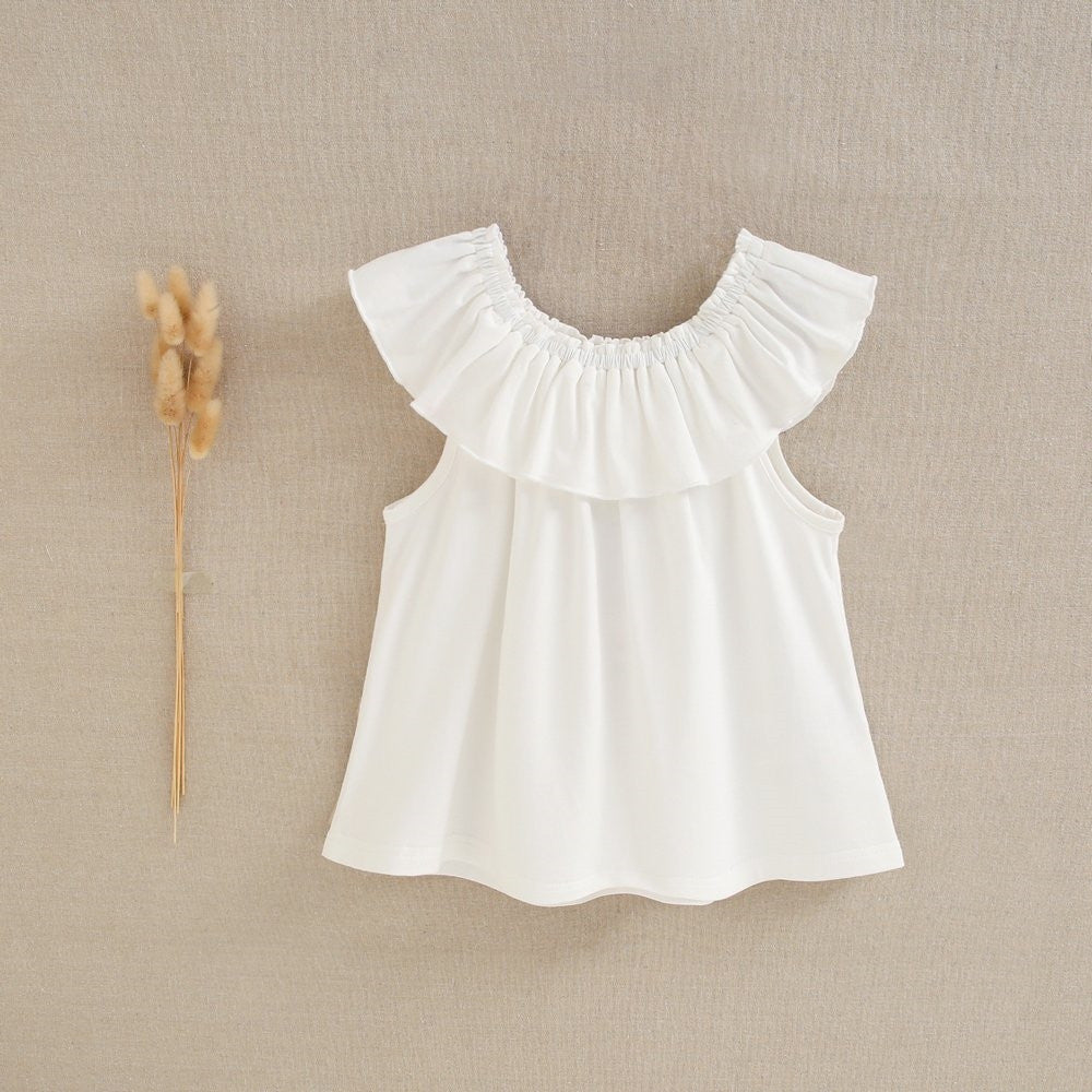 Blusa niña volante blanca