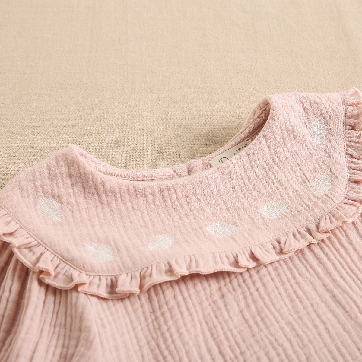 Blusa de niña rosa palo en tejido bambula