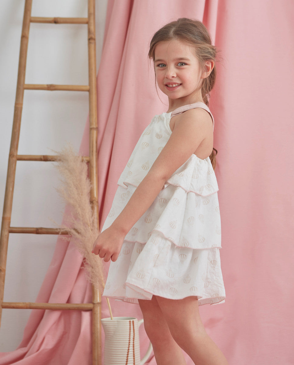 Vestido de niña blanco con globos y detalles en rosa