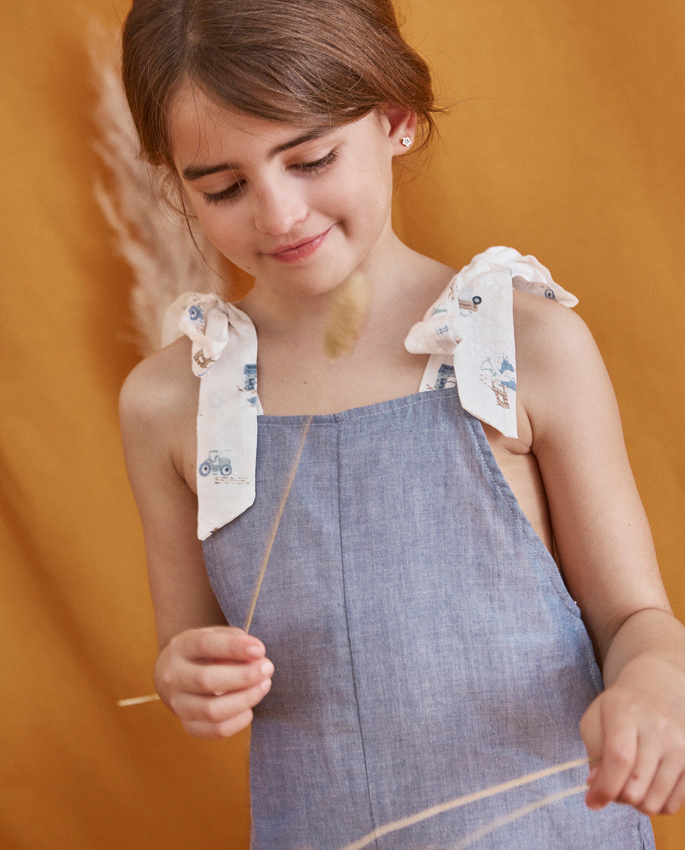 Enterito de niña corto en azul denim combinado con estampado