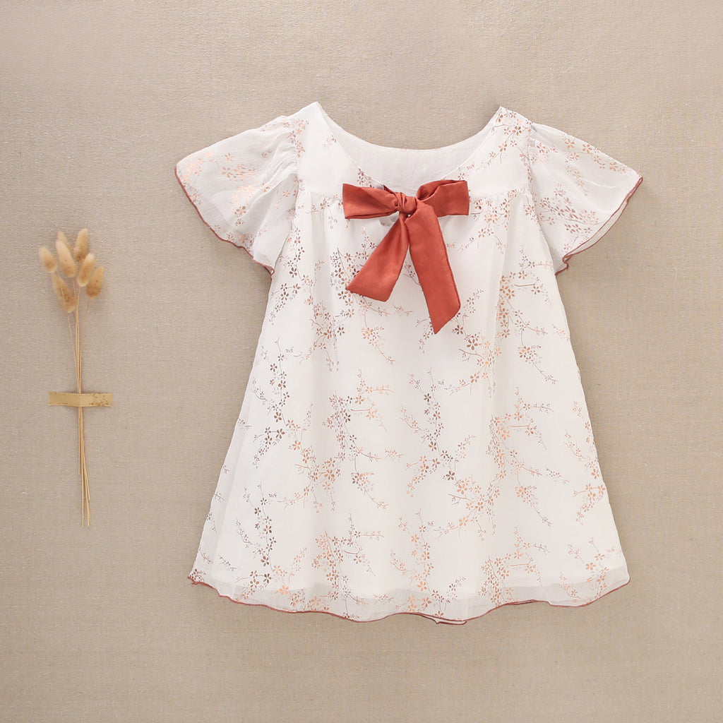 Vestido de niña en gasa con estampado en color cobre