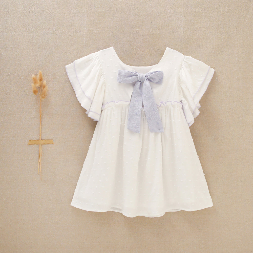 Vestido de niña blanco con ribetes lilas