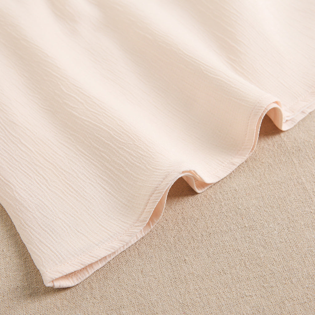 Vestido de niña en gasa en color beige