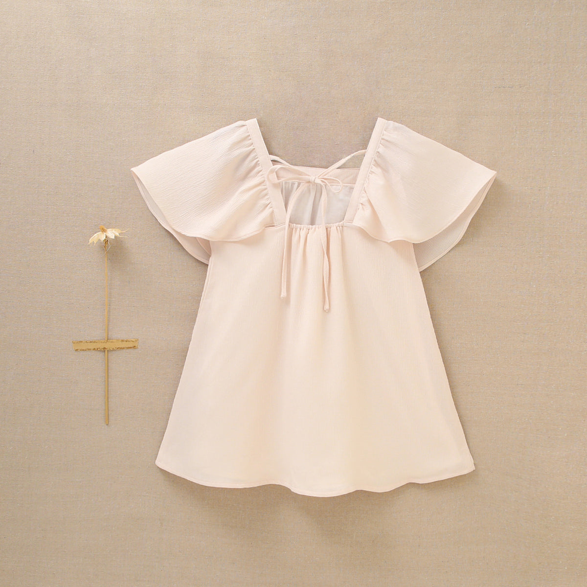 Vestido de niña en gasa en color beige