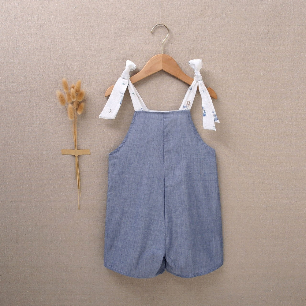 Enterito de niña corto en azul denim combinado con estampado