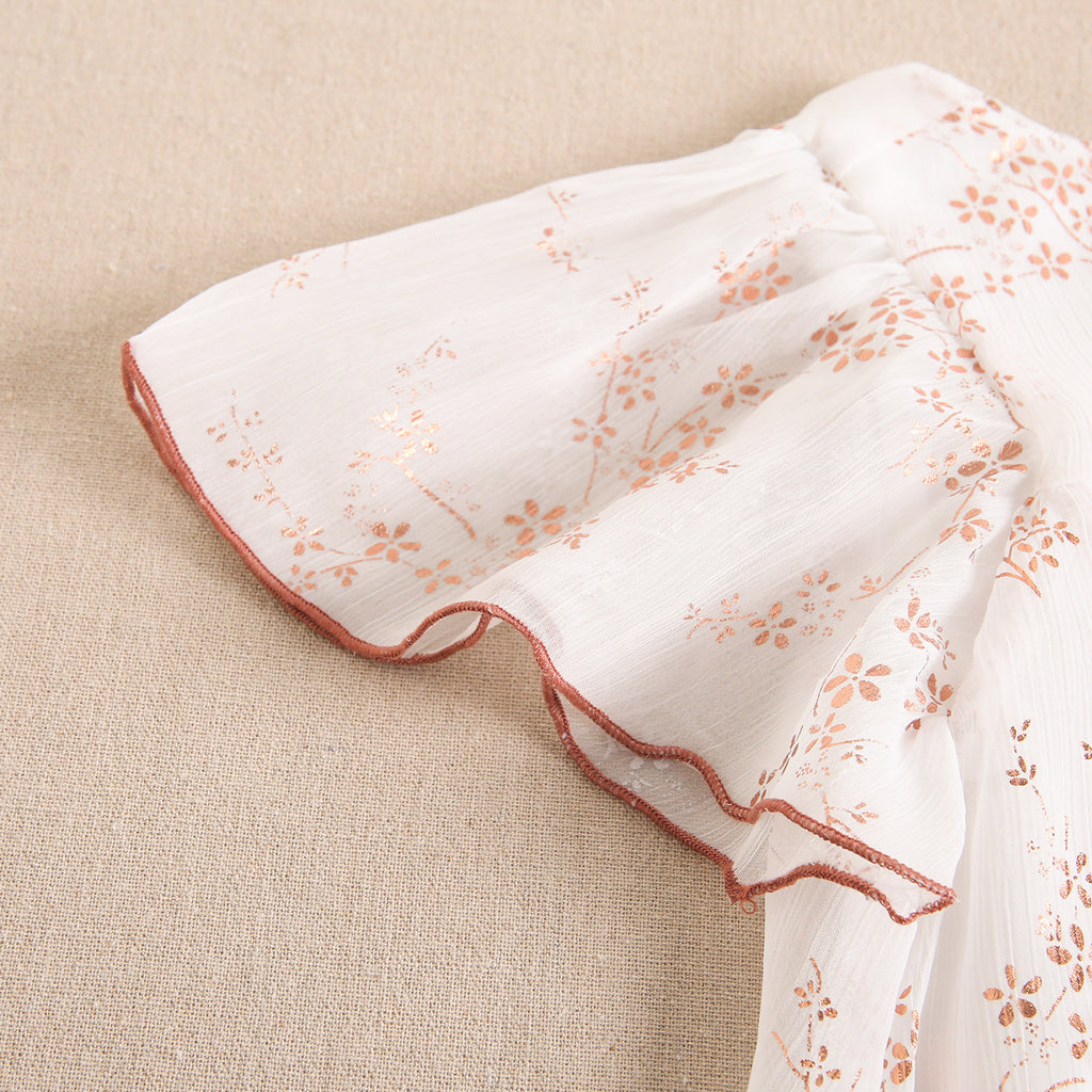 Vestido de niña en gasa con estampado en color cobre