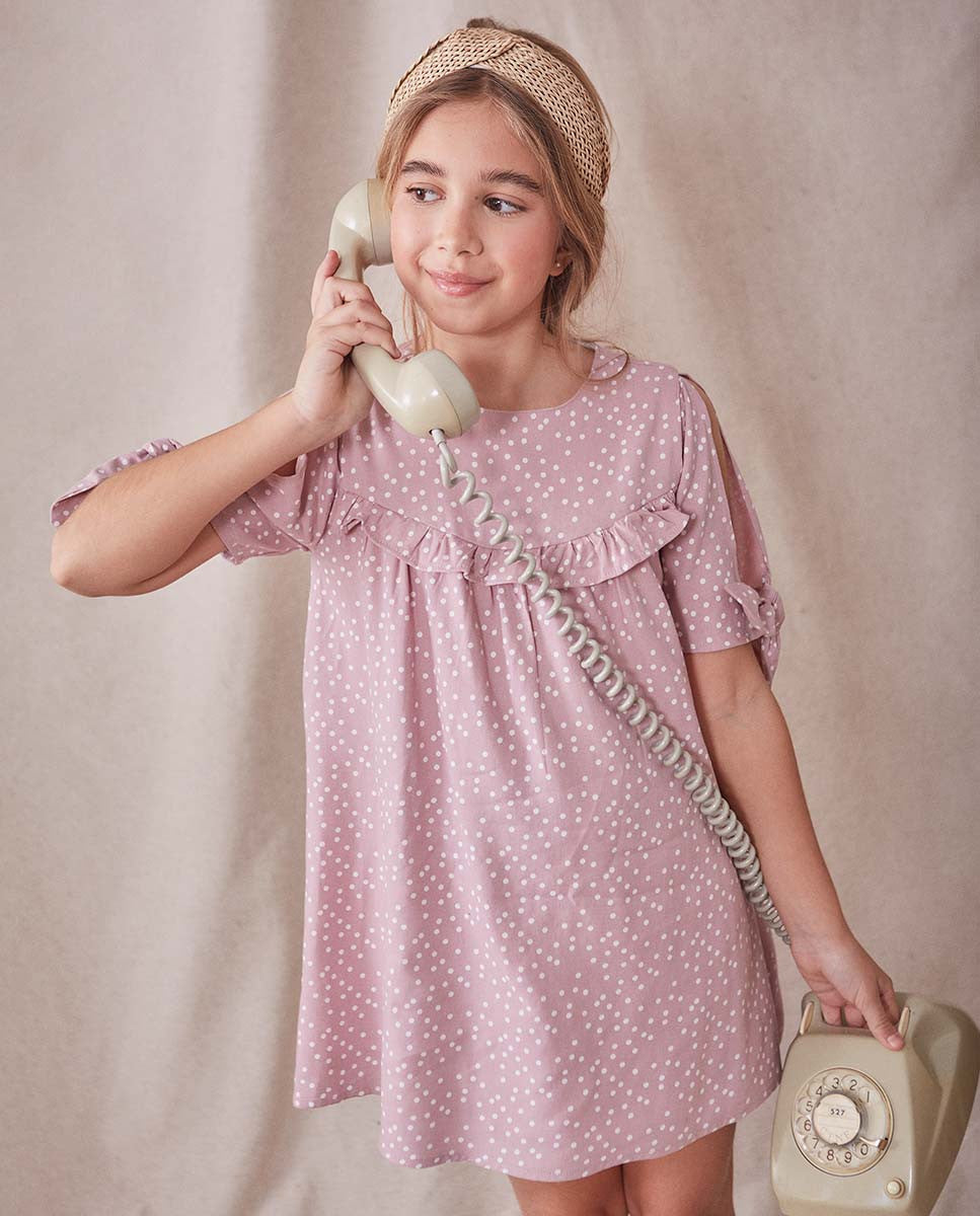 Vestido de niña rosa con lunares blancos
