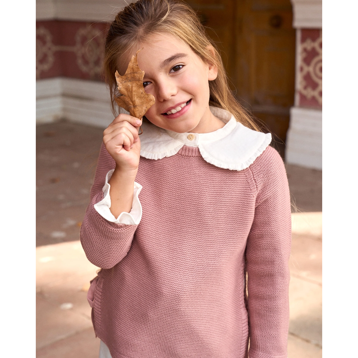 Jersey de niña de punto en rosa con lazos laterales