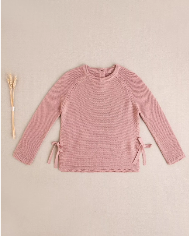 Jersey de niña de punto en rosa con lazos laterales