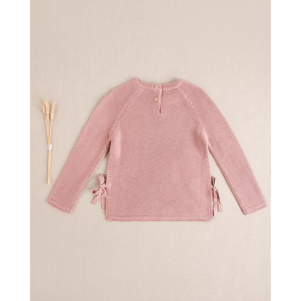 Jersey de niña de punto en rosa con lazos laterales