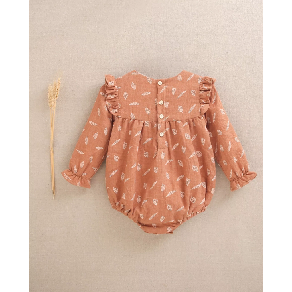 Ranita de bebé niña teja con estampado y detalle de borla
