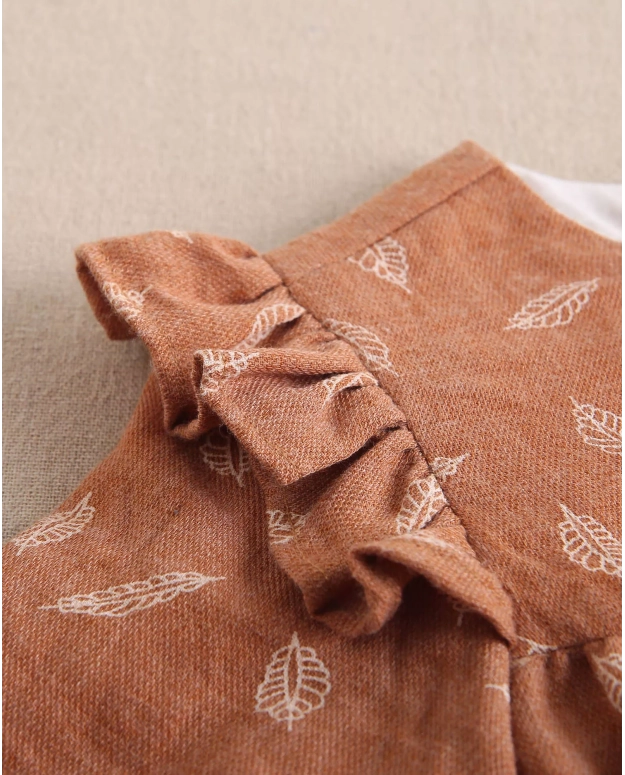 Ranita de bebé niña teja con estampado y detalle de borla