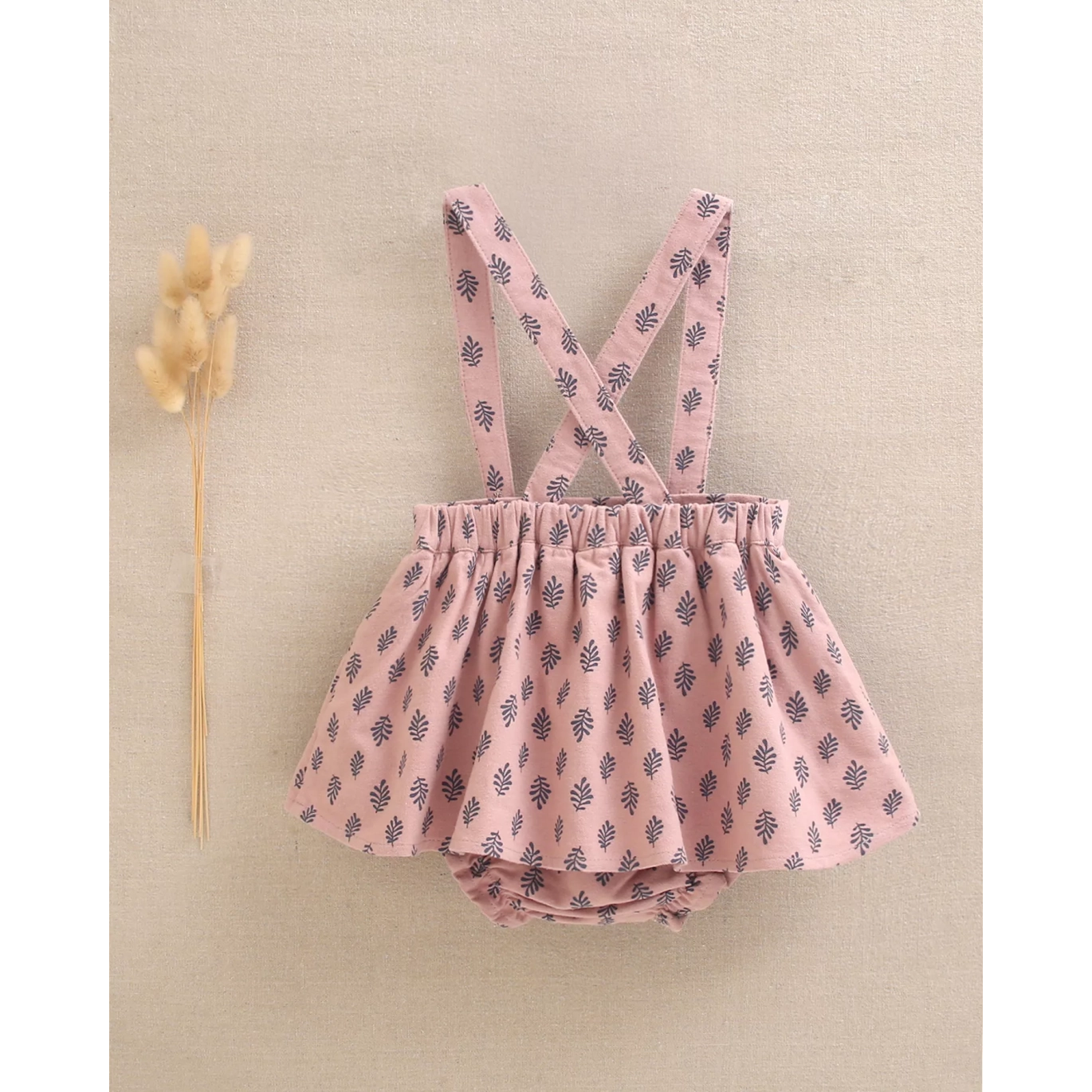 Ranita de bebé niña rosa con estampado de hojas azules
