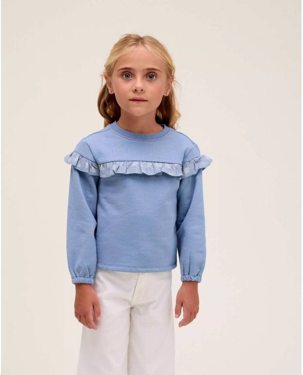 Polerón de niña azul con detalle de volante