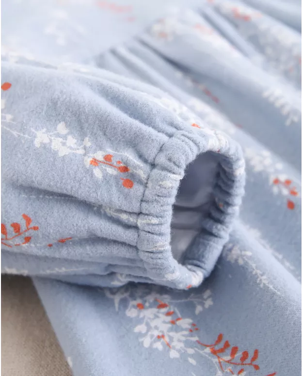 Vestido de bebé niña azul con cuello con volante bordado