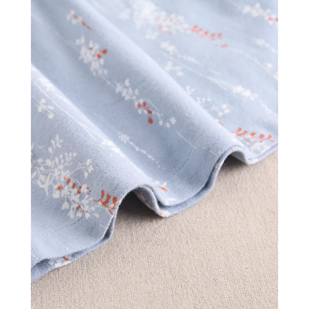 Vestido de bebé niña azul con cuello con volante bordado