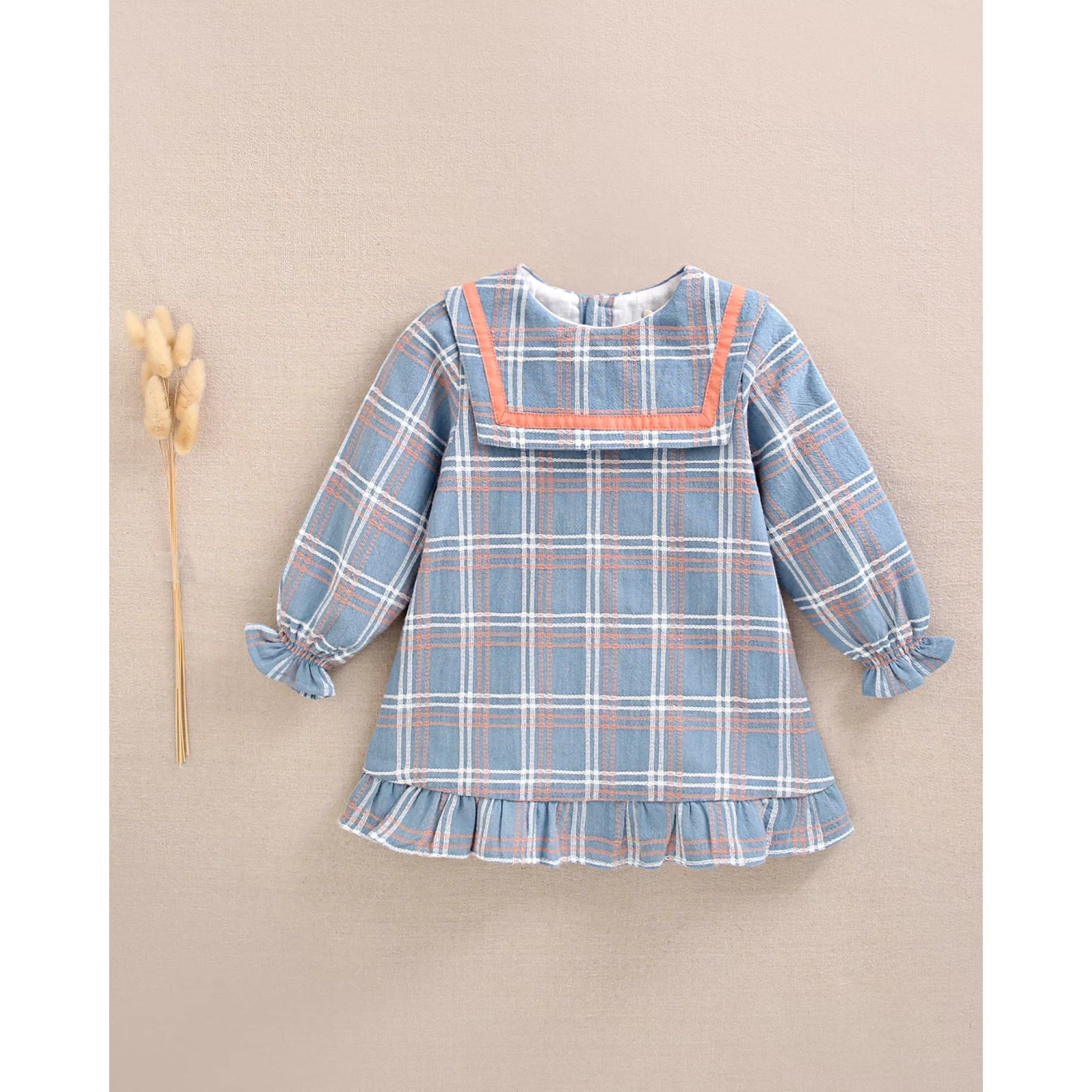 Vestido de bebé niña azul con detalle lazo y ribete naranja