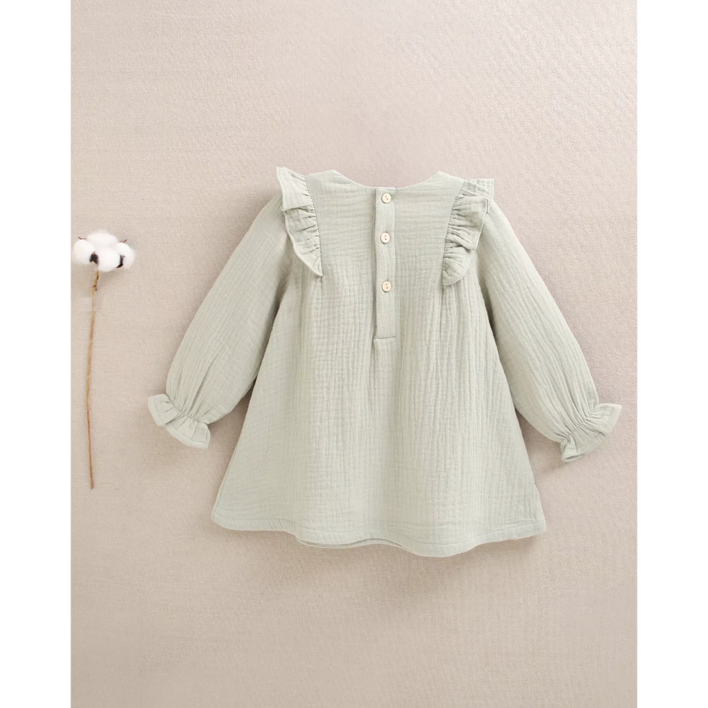 Vestido de bebé niña de muselina en verde con detalle floral en el cuello