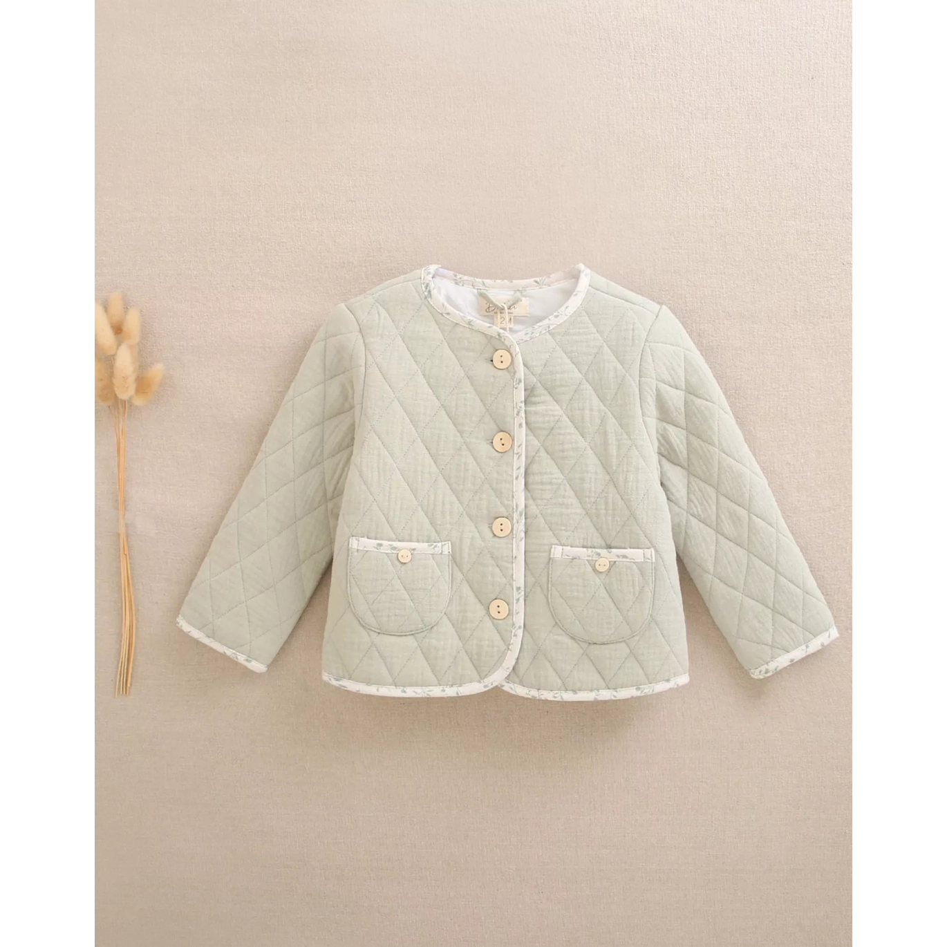 Chaqueta de bebé niña acolchada en verde con bolsillos