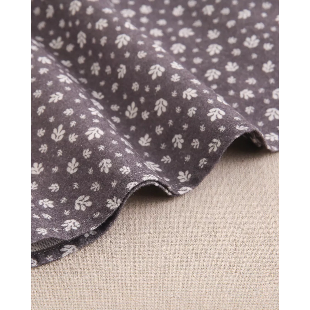 Vestido de bebé niña gris con hojas blancas