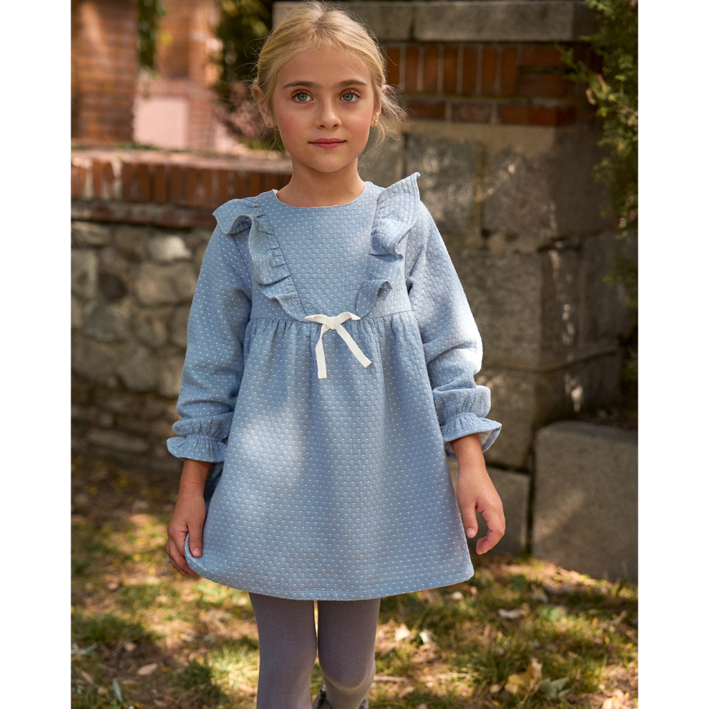 Vestido de niña azul con detalle de lazo y topitos blancos