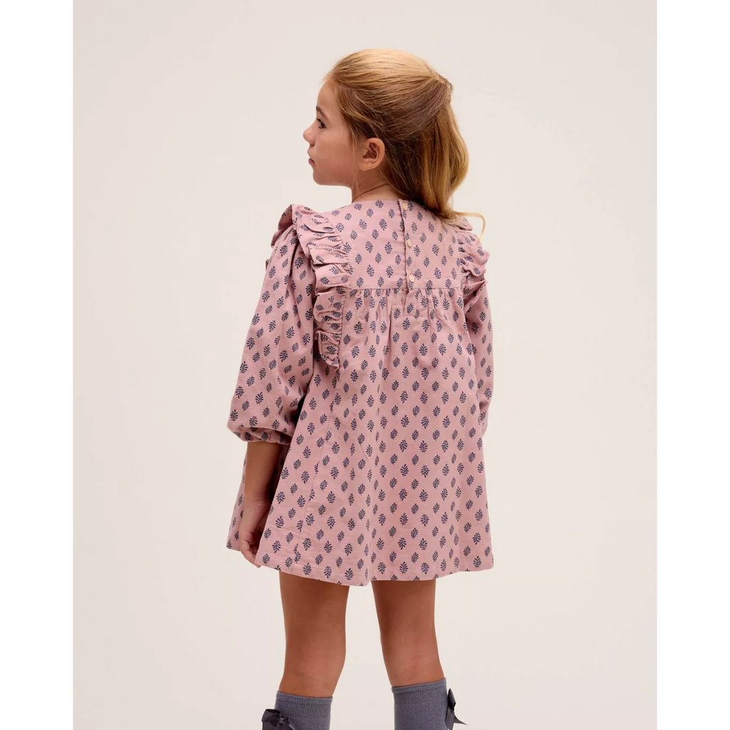 Vestido de niña rosa con estampado de hojas azules